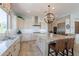 Bright kitchen boasts white cabinets, granite countertops, and stainless steel appliances at 36298 N Crucillo Dr, Queen Creek, AZ 85140