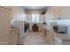 Convenient laundry room boasting ample counter space, storage cabinets, and modern washer and dryer units at 36298 N Crucillo Dr, Queen Creek, AZ 85140
