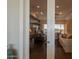 A view into the cozy living room with modern decor with hardwood flooring for a comfortable atmosphere at 36298 N Crucillo Dr, Queen Creek, AZ 85140