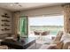 Living room featuring a seamless transition to the outdoor patio with seating and scenic views at 36298 N Crucillo Dr, Queen Creek, AZ 85140