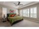 Inviting main bedroom with plantation shutters allowing natural light and stylish tray ceiling at 36298 N Crucillo Dr, Queen Creek, AZ 85140