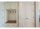 Mudroom features coat hooks, a wooden bench, and storage compartments to keeps everything organized and tidy at 36298 N Crucillo Dr, Queen Creek, AZ 85140