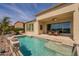 Inviting backyard pool and covered patio with outdoor seating, perfect for relaxation and entertaining at 36298 N Crucillo Dr, Queen Creek, AZ 85140