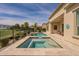 Inviting backyard pool and spa with golf course view, desert landscaping, and patio area at 36298 N Crucillo Dr, Queen Creek, AZ 85140