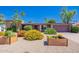 Charming home with desert landscaping and colorful flowering bushes in planter boxes at 3823 E Poinsettia Dr, Phoenix, AZ 85028