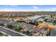 Real estate photograph of the community with nearby school and mountain views in the distance at 3872 E Jude Ln, Gilbert, AZ 85298