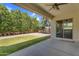 Covered patio offers views of lush backyard, artificial turf, privacy landscaping, and open space at 3872 E Jude Ln, Gilbert, AZ 85298