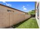 Enjoy this manicured backyard, lined with an extended privacy wall at 3872 E Jude Ln, Gilbert, AZ 85298
