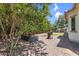 Relax in this backyard featuring desert landscaping, a patio, a grill, and a garden box at 3872 E Jude Ln, Gilbert, AZ 85298