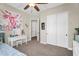 Cozy bedroom with a unicorn theme, white desk, and closet at 3872 E Jude Ln, Gilbert, AZ 85298