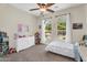Bright bedroom with carpet, two large windows, and charming decor at 3872 E Jude Ln, Gilbert, AZ 85298