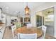 Sunlit breakfast nook with round table and views extending to the kitchen, living, and outdoor spaces at 3872 E Jude Ln, Gilbert, AZ 85298