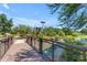 A charming bridge leading to a lush green space, perfect for families to enjoy outdoor activities and serene moments at 3872 E Jude Ln, Gilbert, AZ 85298