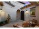 Private courtyard featuring a fountain, string lights, and comfortable seating at 3872 E Jude Ln, Gilbert, AZ 85298