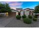 Inviting home with a two-car garage, meticulously landscaped front yard, and appealing curb appeal at 3872 E Jude Ln, Gilbert, AZ 85298