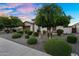Charming home with lush landscaping, a two-car garage, and a well-manicured front yard at 3872 E Jude Ln, Gilbert, AZ 85298