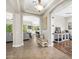 Bright hallway featuring tile flooring, arched doorways, and views into the living spaces at 3872 E Jude Ln, Gilbert, AZ 85298