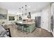 Bright, open kitchen with large island, stainless steel appliances, and breakfast bar seating at 3872 E Jude Ln, Gilbert, AZ 85298