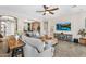 Expansive living room featuring a large sectional, open layout, and stylish decor at 3872 E Jude Ln, Gilbert, AZ 85298