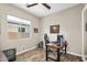 Well-lit home office space with a large window, desk, and comfortable chair for a productive work environment at 3872 E Jude Ln, Gilbert, AZ 85298
