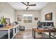 Spacious office with a pet crate cabinet, wood-look floors, and ample natural light at 3872 E Jude Ln, Gilbert, AZ 85298