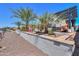 Inviting backyard patio with pergola, perfect for outdoor dining and entertaining with a water view at 40725 W Hall Dr, Maricopa, AZ 85138