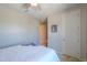Neutral bedroom featuring a ceiling fan, closet, and modern decor at 40725 W Hall Dr, Maricopa, AZ 85138