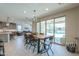 Open dining room with direct access to the outdoor pool area through large sliding glass doors at 40725 W Hall Dr, Maricopa, AZ 85138