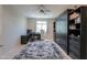 Versatile home office or bedroom with built-in shelving and window view at 40725 W Hall Dr, Maricopa, AZ 85138