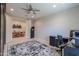 Spacious home office with modern desk setup and convenient doorway at 40725 W Hall Dr, Maricopa, AZ 85138