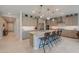 Beautiful kitchen featuring a huge island, stainless appliances, and plenty of cabinet space at 40725 W Hall Dr, Maricopa, AZ 85138