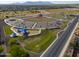 Aerial view of a well-maintained sports complex with baseball fields, parking, and picnic areas at 40725 W Hall Dr, Maricopa, AZ 85138