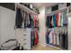 Well-organized walk-in closet with custom shelving and ample storage at 40725 W Hall Dr, Maricopa, AZ 85138