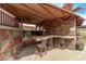 Community grilling area with counter seating, stainless steel grill and stone accents at 4120 N 78Th St # 216, Scottsdale, AZ 85251