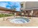 Community hot tub with stone and greenery accents, featuring nearby seating at 4120 N 78Th St # 216, Scottsdale, AZ 85251