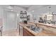 Kitchen sink features granite countertops, stainless steel appliances and pass through to living room at 4120 N 78Th St # 216, Scottsdale, AZ 85251