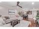 Inviting living room with a plush sectional sofa and stylish decor, perfect for relaxation and entertaining at 4120 N 78Th St # 216, Scottsdale, AZ 85251