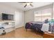 Bedroom with TV, ceiling fan and tiled flooring at 4629 N 78Th Dr, Phoenix, AZ 85033