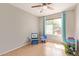 bedroom with colorful decor, a large window and tile flooring at 4629 N 78Th Dr, Phoenix, AZ 85033