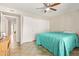 Bright bedroom featuring tiled floors, a ceiling fan and wide closet doors at 4629 N 78Th Dr, Phoenix, AZ 85033