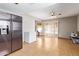 Open kitchen area featuring stainless steel refrigerator and access to a sunroom at 4629 N 78Th Dr, Phoenix, AZ 85033