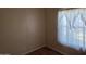 Bedroom featuring wood-look flooring and a large window providing natural light at 5402 E Mckellips Rd # 103, Mesa, AZ 85215