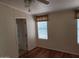 Bedroom featuring natural light, wood floors, and ceiling fan at 5402 E Mckellips Rd # 103, Mesa, AZ 85215