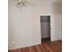 Cozy bedroom with wood floors and a closet at 5402 E Mckellips Rd # 103, Mesa, AZ 85215