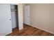 Bedroom featuring a closet with sliding doors and wood-look flooring at 5402 E Mckellips Rd # 103, Mesa, AZ 85215