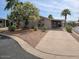 Charming single-story home with well-maintained landscaping and a covered parking area at 5402 E Mckellips Rd # 103, Mesa, AZ 85215