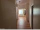 Hallway with wood floors and a view into other rooms at 5402 E Mckellips Rd # 103, Mesa, AZ 85215