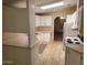 Traditional kitchen showcasing white cabinetry and pink countertops at 5402 E Mckellips Rd # 103, Mesa, AZ 85215