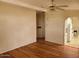 Bright living room featuring hardwood flooring, a ceiling fan, and neutral paint at 5402 E Mckellips Rd # 103, Mesa, AZ 85215