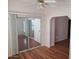 Bright living room featuring hardwood floors and sliding glass doors to an outdoor space at 5402 E Mckellips Rd # 103, Mesa, AZ 85215